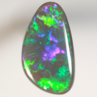 SOLID BLACK OPAL Neon turquoise and green in large rolling flashes. SEE VIDEO